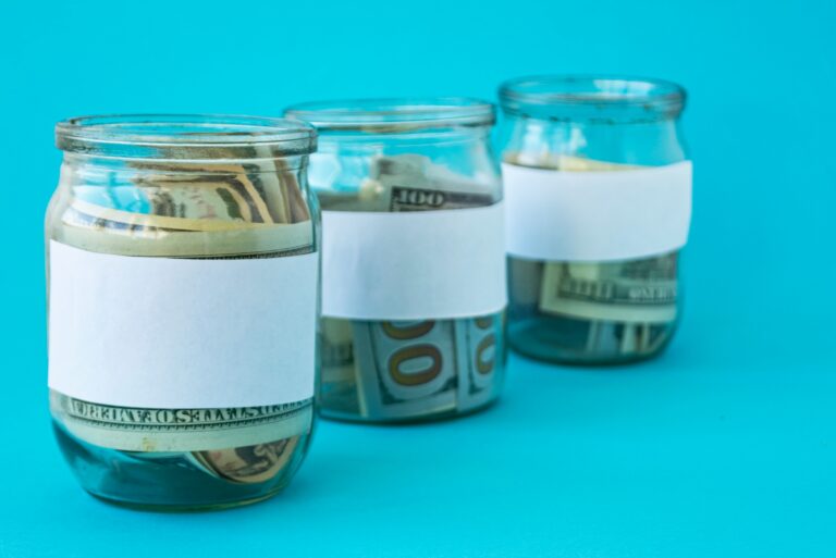 Three Glass Jars Containing Money