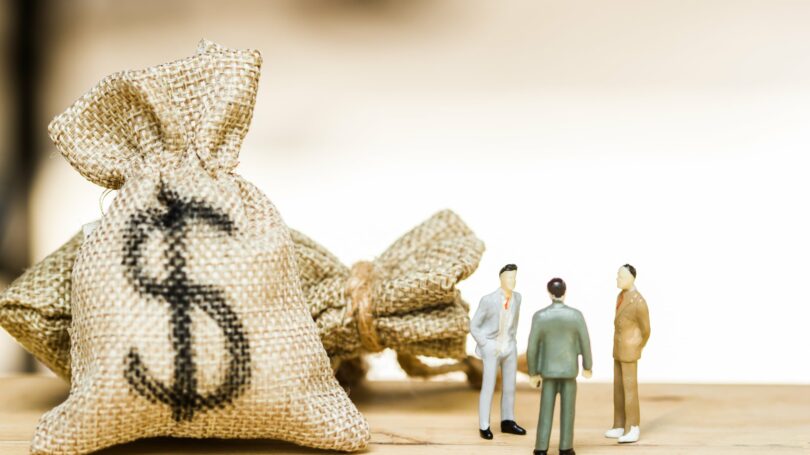 Money Bags Group Of Men Discussing Money