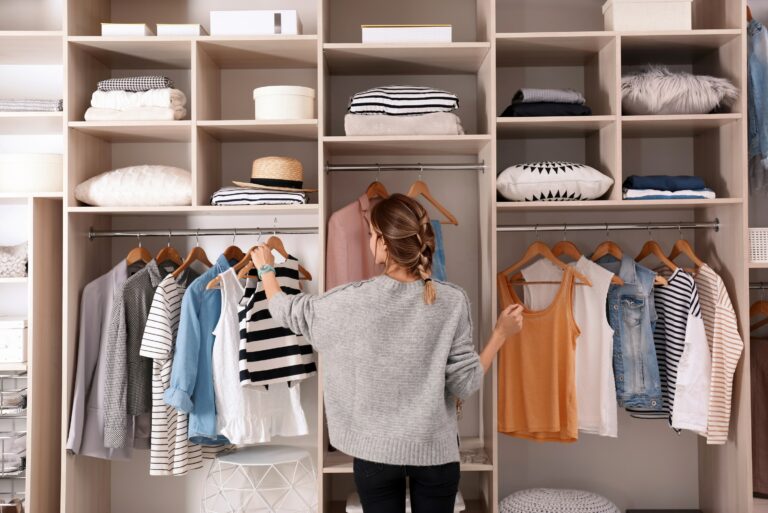 Woman Organizing Her Closet Decluttering Wardrobe