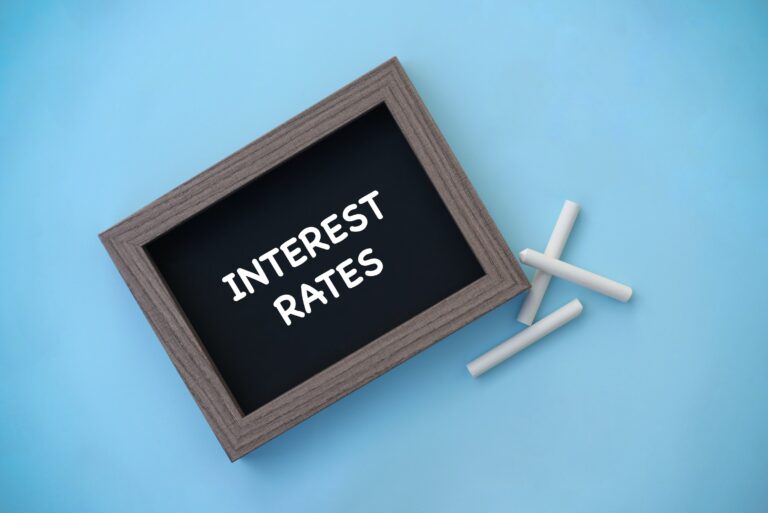 Interest Rates Written On Chalkboard Chalk