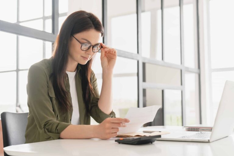 Woman Reading Bank Statement